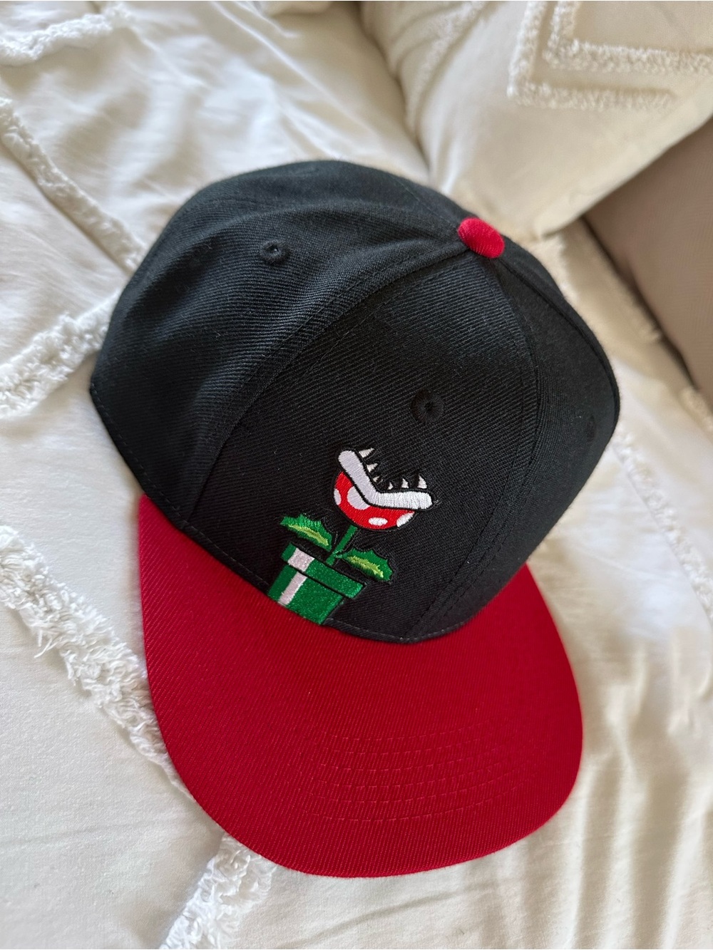 Black & Red Snapback Hat with Embroidered Piranha Plant